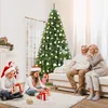 A family is opening Christmas presents in front of a decorated Christmas tree. Náhled obrázku produktu