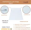 A white shaggy rug is shown with close-up insets highlighting its texture and durability. Text describes its features and certifications. Anteprima dell’immagine prodotto