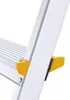 A close-up view of a section of an aluminum ladder, focusing on the yellow plastic safety clips and the metal structure. Náhľad obrázku produktu