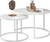 A set of two white nesting coffee tables with a decorative lion head sculpture on the smaller table and a decanter and glasses on the larger table. Náhled obrázku produktu