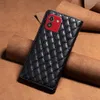A black quilted leather phone case with a red camera accent is displayed on a brown leather background. Produktbild-Vorschau