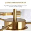 Close-up of a brass chandelier base with text overlay describing quality and materials. Produktbild-Vorschau