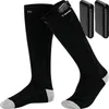 A pair of black heated socks with gray accents on the toes and heels, along with two black battery packs. Podgląd zdjęcia produktu