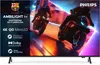 A television screen displaying a dynamic image of two motorcyclists in action, with various feature callouts and logos on the left side. Voir les images du produit