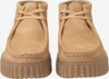 A pair of brown Clarks clogs are shown from the front against a white background. Voir les images du produit