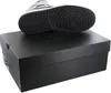 A shoe is placed on top of its box. Anteprima dell’immagine prodotto