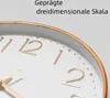 Close-up of a clock face with gold numbers and trim. Produktbild-Vorschau