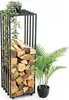 A black metal firewood rack filled with logs, next to a potted plant. Produktbild-Vorschau