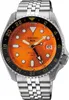 A close-up studio shot of a men's Seiko 5 Sports GMT watch with an orange dial and a stainless steel bracelet. Podgląd zdjęcia produktu