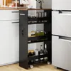 A narrow black kitchen cart with four shelves is placed between a white cabinet and a refrigerator. Podgląd zdjęcia produktu