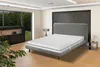 A bedroom with a bed and mattress. Produktbild-Vorschau