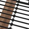 A close-up view of a bed frame with wooden slats and black metal supports. Náhled obrázku produktu