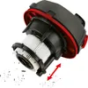 A close-up view of a vacuum cleaner filter and motor housing, with debris falling from the filter. Produktbild-Vorschau