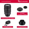 A product listing image showing a camera lens and its accessories with descriptive text. Produktbild-Vorschau
