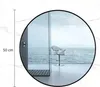 Miroir mural rond moderne (50 cm) avec cadre en métal noir Voir les images du produit 4