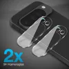 Two clear camera lens protectors are shown on top of a black smartphone's camera module. Produktbild-Vorschau