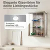 A glass display cabinet mounted on a wall, showcasing various collectible items. An inset image highlights an LED light feature. Produktbild-Vorschau