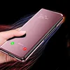 A hand holding a rose gold smartphone with a reflective flip case, showing a notification for an incoming call. Produktbild-Vorschau