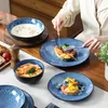 A table setting with a person eating. Voir les images du produit