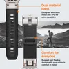 A close-up of a watch band with a scenic mountain background and a hiker. Anteprima dell’immagine prodotto