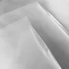 Close-up view of several transparent plastic sheets with a textured pattern, layered diagonally. Produktbild-Vorschau