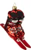 A glass ornament of red ski boots attached to short skis. Voir les images du produit