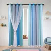 A room with blue gradient curtains with white tulle overlays, decorated with small white stars. Voir les images du produit