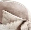 A close-up view of the interior of a bag, showing the lining and a pocket. Náhled obrázku produktu