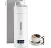 A white portable kettle with a digital display and a cup of coffee next to it. Produktbild-Vorschau