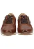 A front view of a pair of brown leather sneakers. Produktbild-Vorschau
