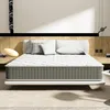 A mattress on a bed frame in a bedroom setting. Voir les images du produit