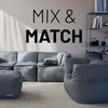 A modular sofa and seating arrangement in a living room setting with text on the wall. Náhled obrázku produktu