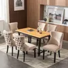 A dining room set with a table and chairs. Produktbild-Vorschau