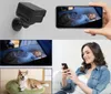 A collage showing a mini indoor camera, a baby sleeping in a crib viewed on a phone, and a woman using her phone while a dog rests on a bed. Produktbild-Vorschau