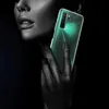A close-up shot of a person's face and hand holding a smartphone. Produktbild-Vorschau