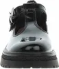A close-up, front-facing view of a black patent leather Mary Jane shoe with a buckle strap and a thick lug sole. Produktbild-Vorschau