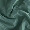 A close-up shot of rumpled green fabric. Produktbild-Vorschau