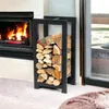 A metal firewood rack filled with logs next to a fireplace. Anteprima dell’immagine prodotto