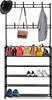 A black metal garment rack and shoe rack with several bags and shoes on it. Produktbild-Vorschau