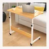 A portable work table with a laptop and a plant next to a couch. Produktbild-Vorschau
