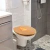 A toilet with a wooden seat in a bathroom. Produktbild-Vorschau