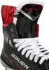 Close-up view of the top part of a black Bauer Vapor X4 ice skate, showing the laces, tongue, and inner lining. Náhľad obrázku produktu