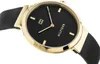 A close-up, angled shot of a Tommy Hilfiger women's watch with a black dial and gold-colored case and mesh strap. Produktbild-Vorschau