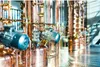 Close-up of industrial copper distillation equipment with motors. Anteprima dell’immagine prodotto