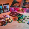 Board game components laid out on a wooden surface. Anteprima dell’immagine prodotto