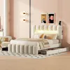 A bedroom scene with a bed, nightstand, and wall art.