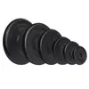 A set of black weight plates of varying sizes arranged diagonally on a white background. Náhled obrázku produktu