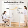 Two women are shown interacting with adjustable height desks in a bright room with a window. Náhľad obrázku produktu