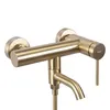 A close-up studio shot of a gold-colored bathroom faucet against a white background. Podgląd zdjęcia produktu