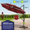 A red cantilever umbrella is shown with various dimensions and features highlighted. The background includes a wooden deck and a grassy area. Produktbild-Vorschau